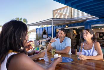 People dining outside at The Gulf waterfront restaurant in Orange Beach