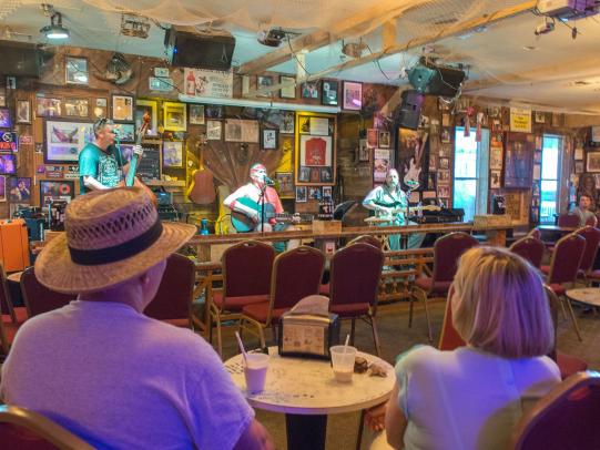 People watching live music at Flora-Bama, famous beach bar in Orange Beach