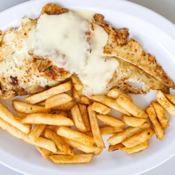 Crab crusted flounder and French fries at The Hammered Crab seafood restaurant in Gulf Shores