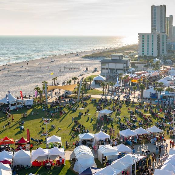 Aerial view of crowd and vendors at Shrimp Festival - free, family-friendly event in Gulf Shores