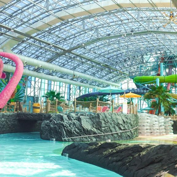 Colorful waterslides and lazy river at Tropic Falls Indoor Waterpark
