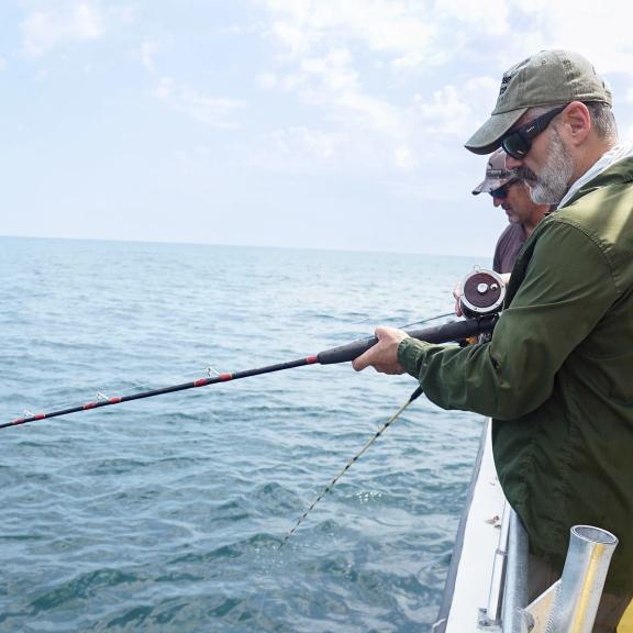 People fishing on a deep-sea fishing charter in the Gulf of Mexico 