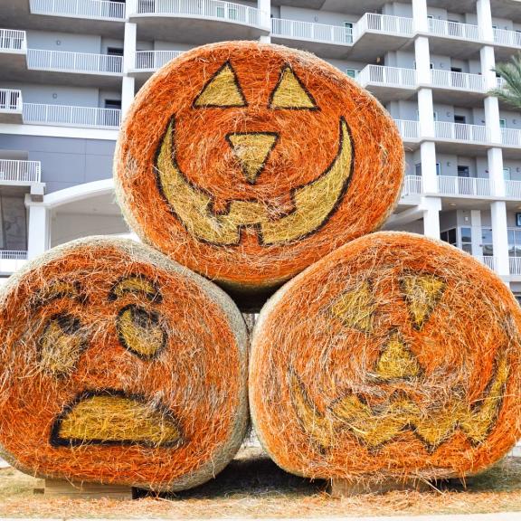 Hay barrels painted for Halloween at The Wharf in Orange Beach