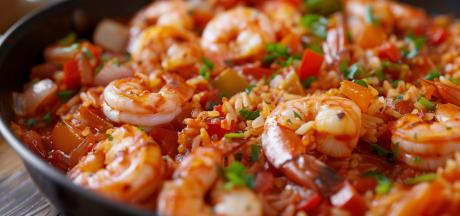 a pan of creole shrimp over rice