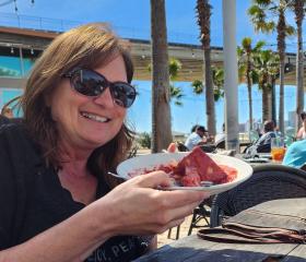 Sara Broers with bread pudding at Cobalt, waterfront restaurant in Orange Beach