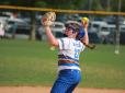 Softball player pitching